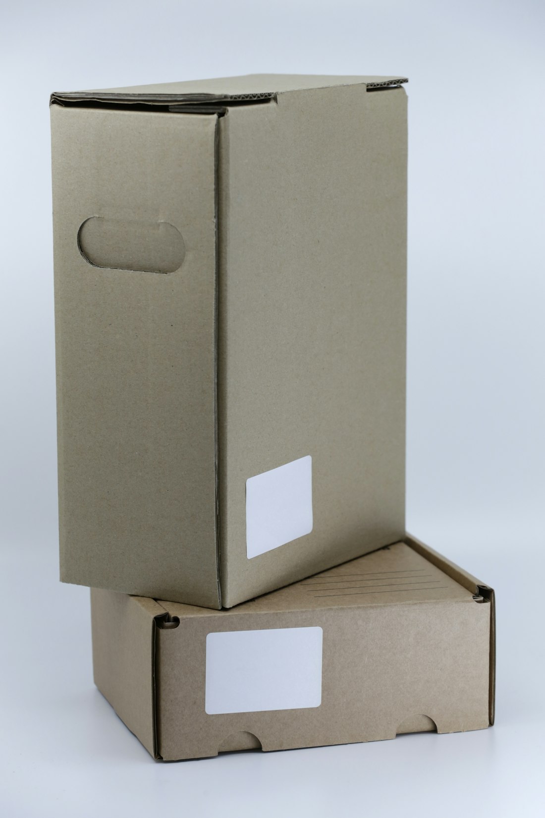 Grey Cardboard Boxes on White Table